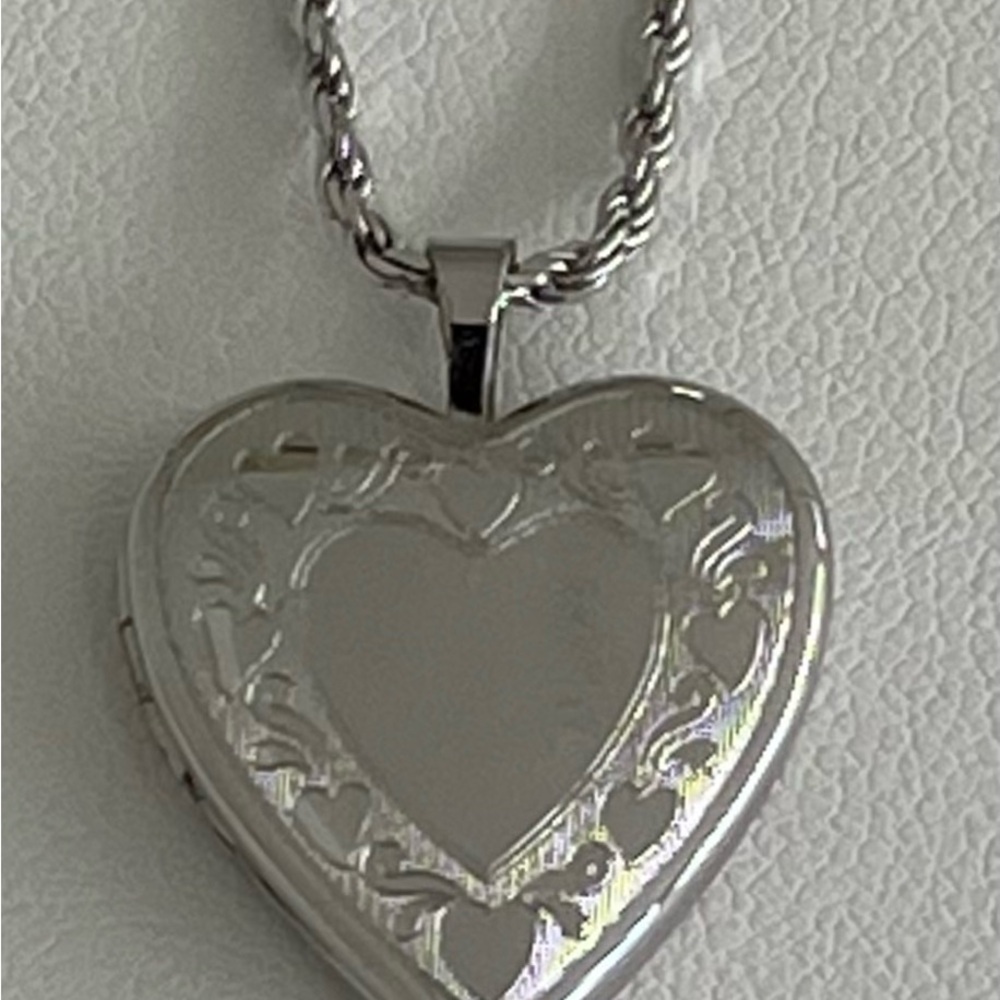 Sterling locket and rope chain.